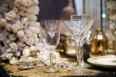 Close-up of wine glasses on table