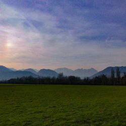 Scenic view of field against sky during sunset