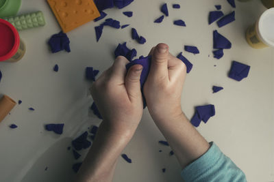 High angle view of baby playing on table
