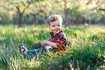 Portrait of smiling boy on land