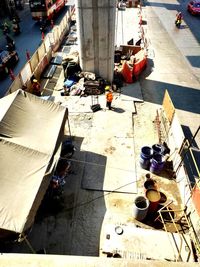 High angle view of people working on street in city