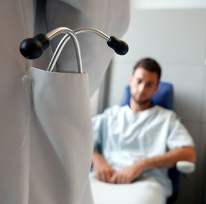 Close-up of stethoscope with patient in hospital