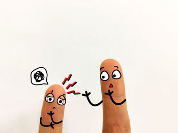 Close-up of human hand against white background