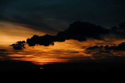 Silhouette landscape against scenic sky