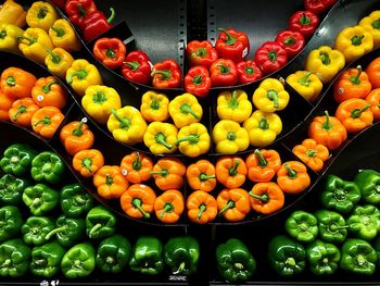 Full frame shot of various bell peppers arranged in shelf