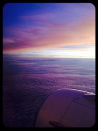 Aerial view of landscape against sky at sunset