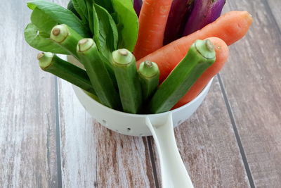 High angle view of chopped vegetables in bowl on table