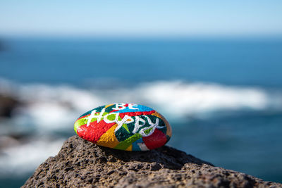 Close-up of multi colored rock on shore