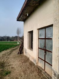 House on field against sky