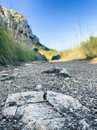 Surface level of road against rocks