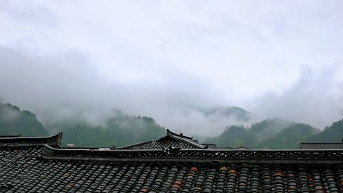 Panoramic view of building against cloudy sky