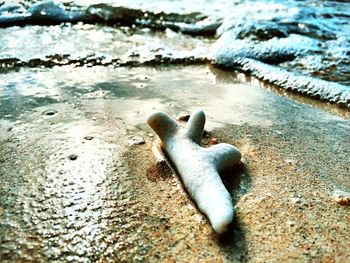 High angle view of rusty metal on beach