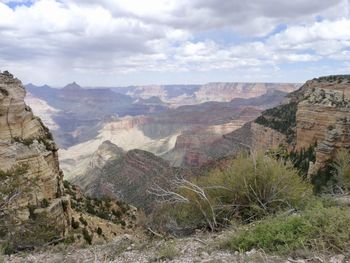 Scenic view of landscape against cloudy sky