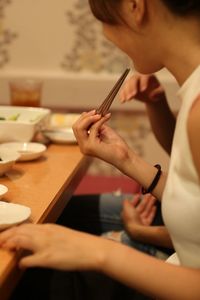 Close-up of woman working on table