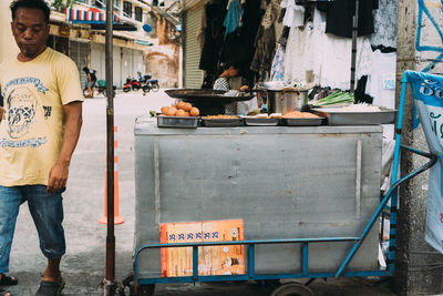 Man standing at market stall
