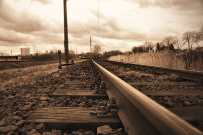 Surface level of railroad tracks against sky