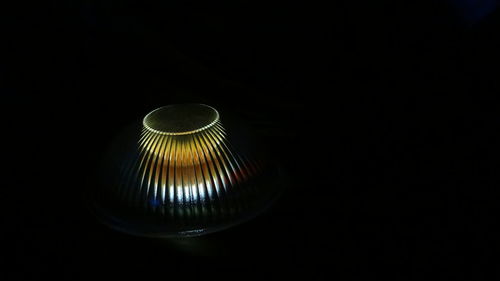 Close-up of illuminated light bulb in the dark