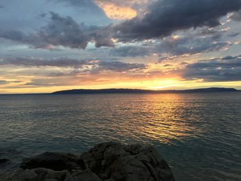 View of calm sea at sunset