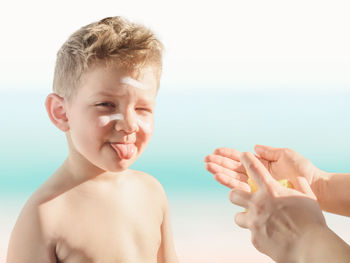 Close-up portrait of shirtless boy