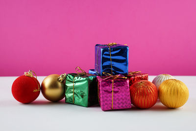 Close-up of christmas decorations against yellow background