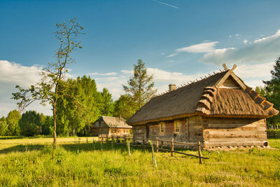 House on field against sky