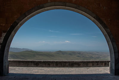 Scenic view of mountains against blue sky