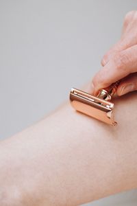 Woman body part with safety shaving razor