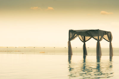 Scenic view of sea against sky at sunset