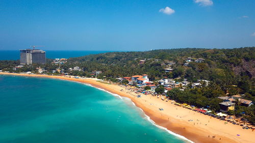 High angle view of  ocean by buildings against sky in sri lanka