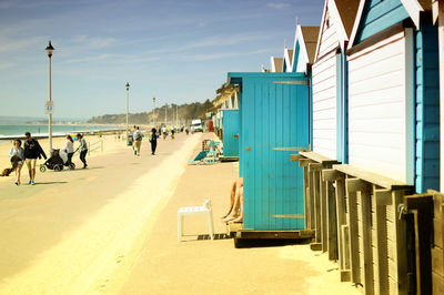 People on beach against sky