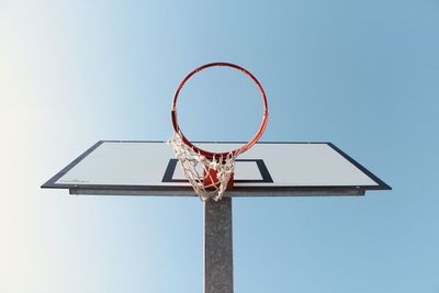 Low angle view of basketball hoop against clear sky