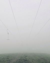 Power lines in foggy weather