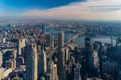 High angle view of modern buildings in city against sky