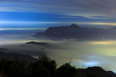 Scenic view of silhouette landscape against sky at night