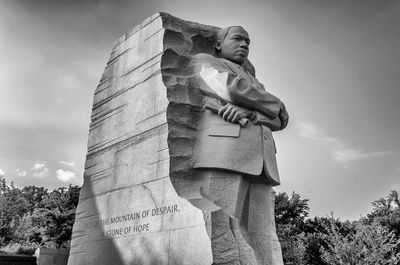 Low angle view of statue against sky