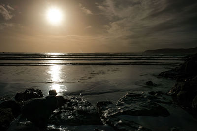 Scenic view of sea against sky during sunset