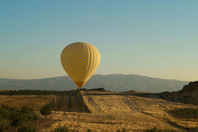 Yellow hot air balloon at cappadocia