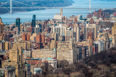 High angle view of modern buildings in city against sky