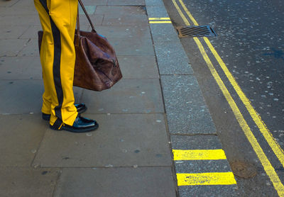 High angle view of yellow umbrella on road