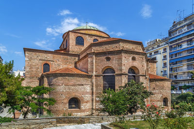 Facade of historic building against sky