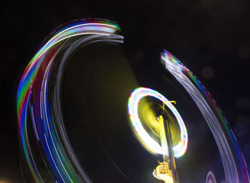 Low angle view of illuminated ferris wheel