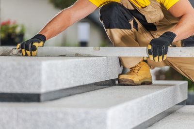 Low angle view of man working on construction site