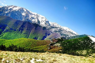 Scenic view of snowcapped mountains against sky