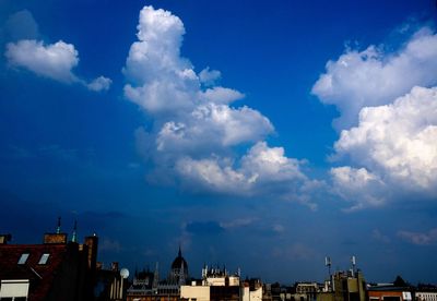 Low angle view of buildings against blue sky