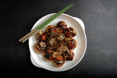 High angle view of takoyaki in bowl on table