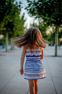 Full length rear view of woman