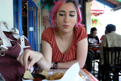 Portrait of woman sitting in restaurant