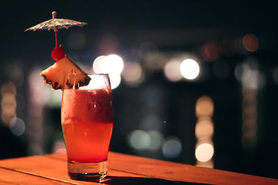 Cocktail drink with city lights background