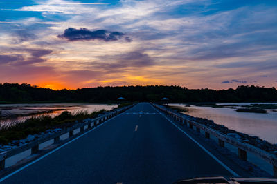 Road against sky during sunset