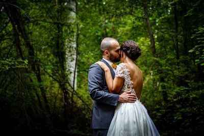 Young couple standing in forest